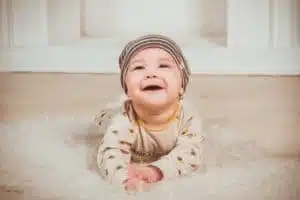 baby playing on the ground