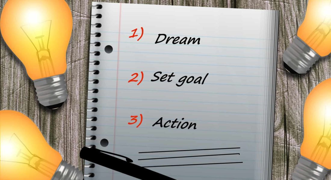 goal affirmations written in a notebook